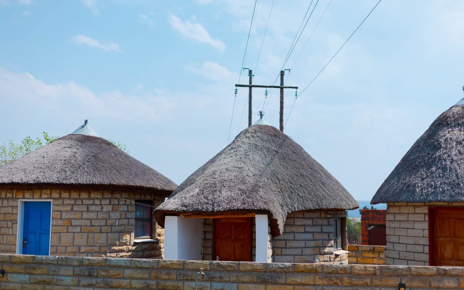 Thatched sandstone rondavel spa rooms at the Hlotse branch